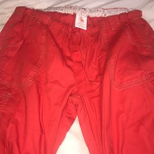 Kathy Peterson red scrub pants w/ green stitching